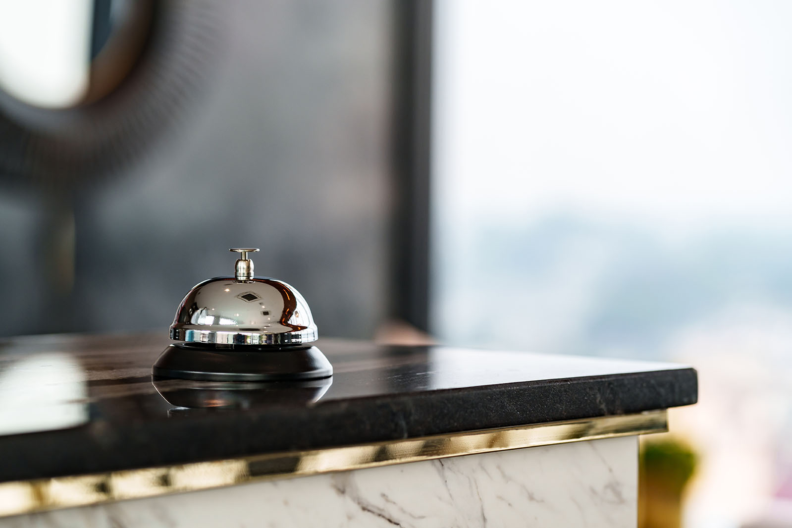 Luxury,Hotel,Reception,Counter,Desk,With,Silver,Service,Bell,,?heck